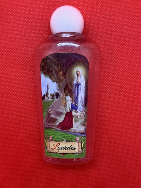 Pequea botella de agua de Lourdes con la imagen de la aparicin