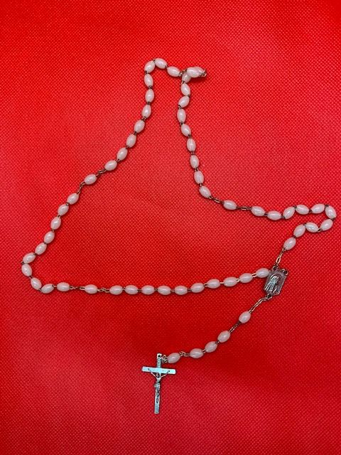Fancy white rosary with image of the virgin and crucifix