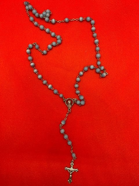 Fancy blue rosary with image of the virgin and crucifix