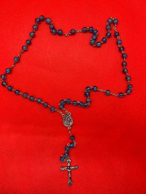 Fancy blue rosary with image of the virgin and crucifix